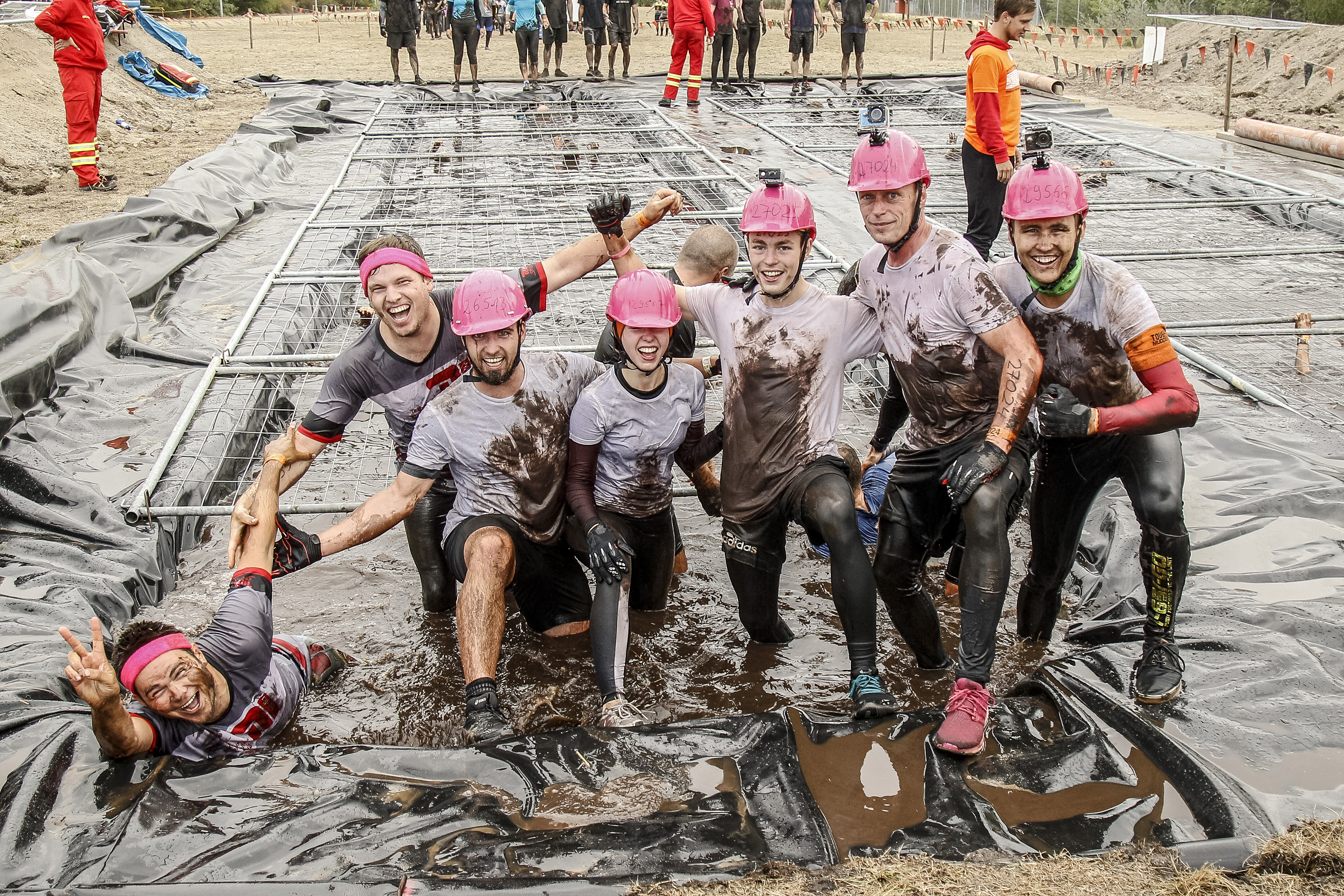 Participants smiling for a photo in Cage Crawl