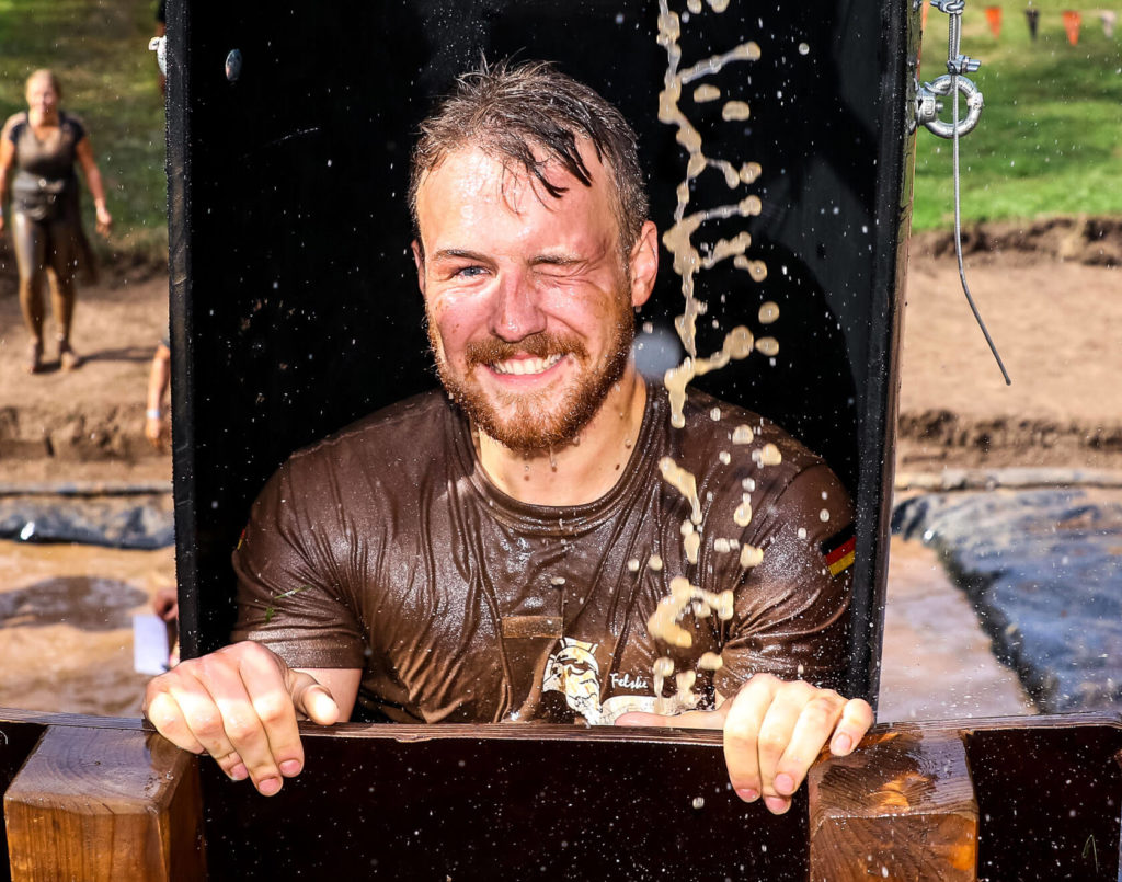 Participant smiling as he reach the top of the tube of Augustus Gloop