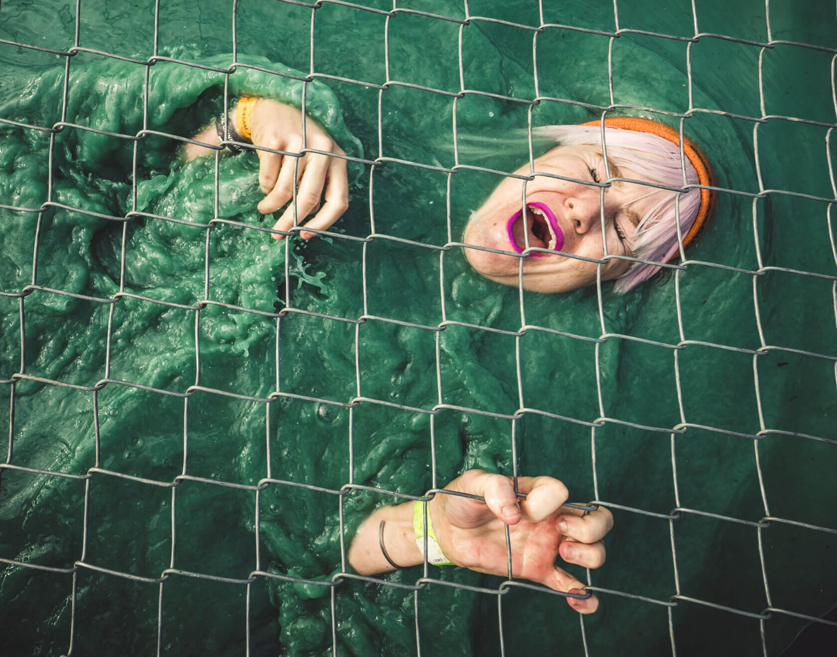 A participant screaming as she floats in the water